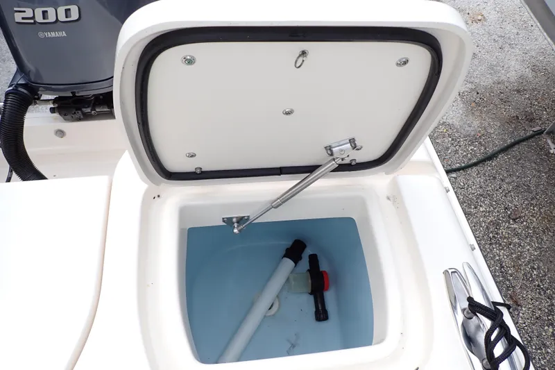 Slide: The Image of Open storage compartment on a 2016 Grady-White Freedom 275 boat, showing interior details. - 23