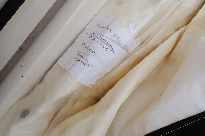 Slide: The Image of 2016 Grady-White Freedom 275 boat with handwritten note on paper. - 62