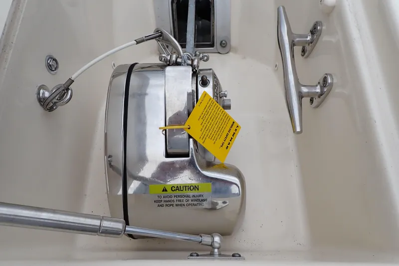 Slide: The Image of 2016 Grady-White Freedom 275 boat winch with caution label and cleat. - 68