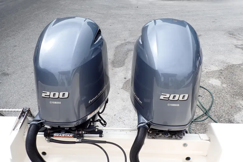 Slide: The Image of Twin Yamaha 200 outboard engines on a 2016 Grady-White Freedom 275 boat. - 7