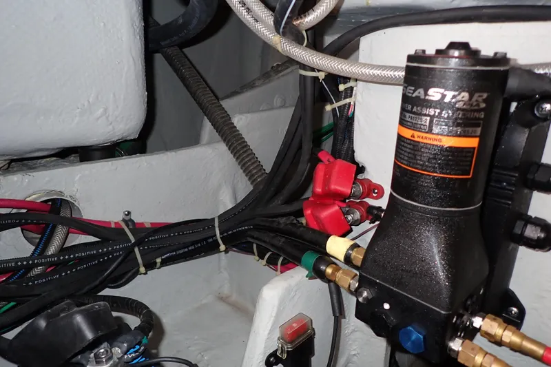 Slide: The Image of 2016 Grady-White Freedom 275 boat wiring and hydraulic system close-up. - 84