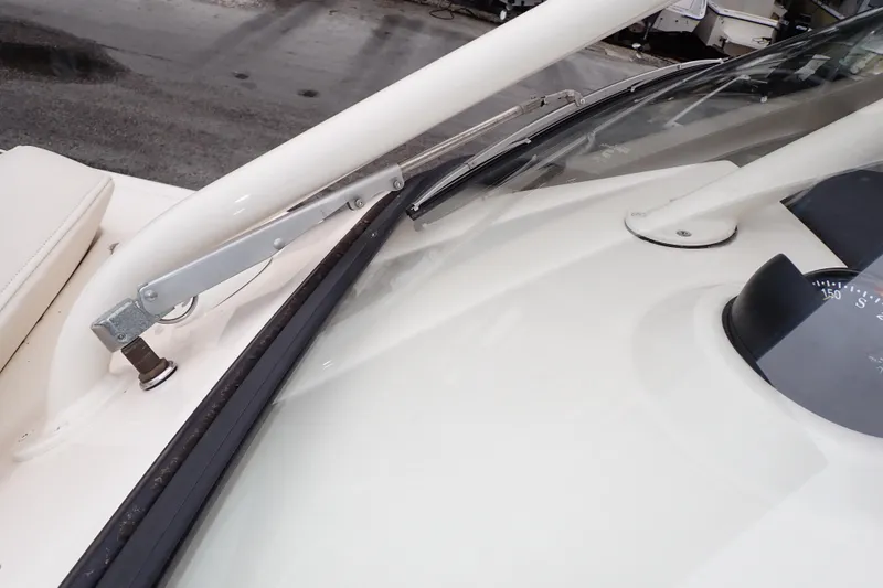 Slide: The Image of 2016 Grady-White Freedom 275 boat windshield and compass detail. - 88