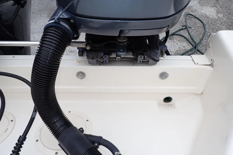 Slide: The Image of 2016 Grady-White Freedom 275 boat engine detail with hoses and fittings. - 93
