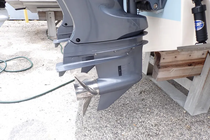 Slide: The Image of 2016 Grady-White Freedom 275 boat engine with stainless steel propeller. - 97