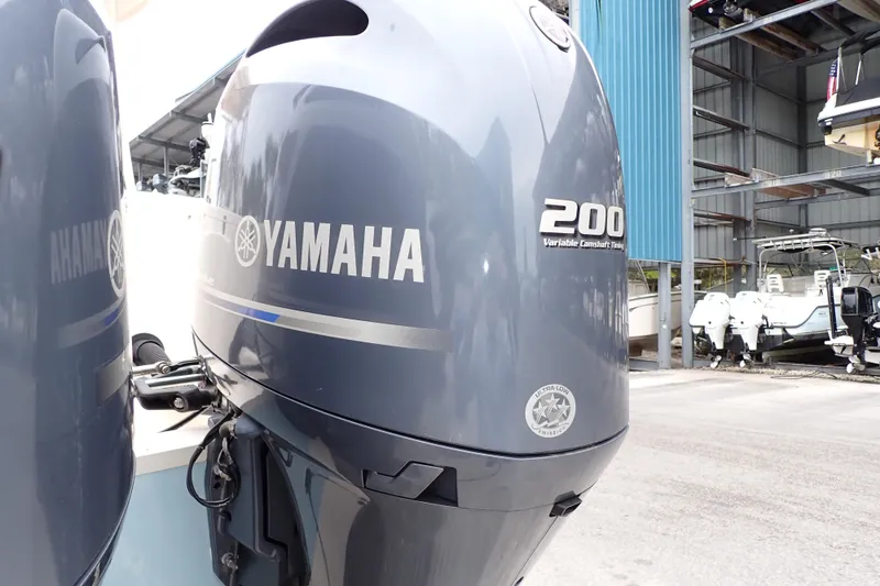 Slide: The Image of Yamaha 200 outboard motor on 2016 Grady-White Freedom 275 boat, dockside view. - 98