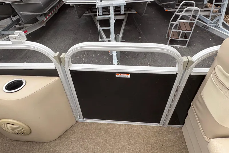 Slide: The Image of 2015 Bennington 20 SLMX pontoon boat interior with seating and cup holder. - 17