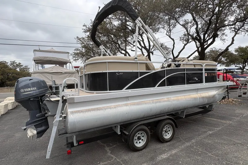 Slide: The Image of 2015 Bennington 20 SLMX pontoon boat on trailer with Yamaha outboard motor. - 7