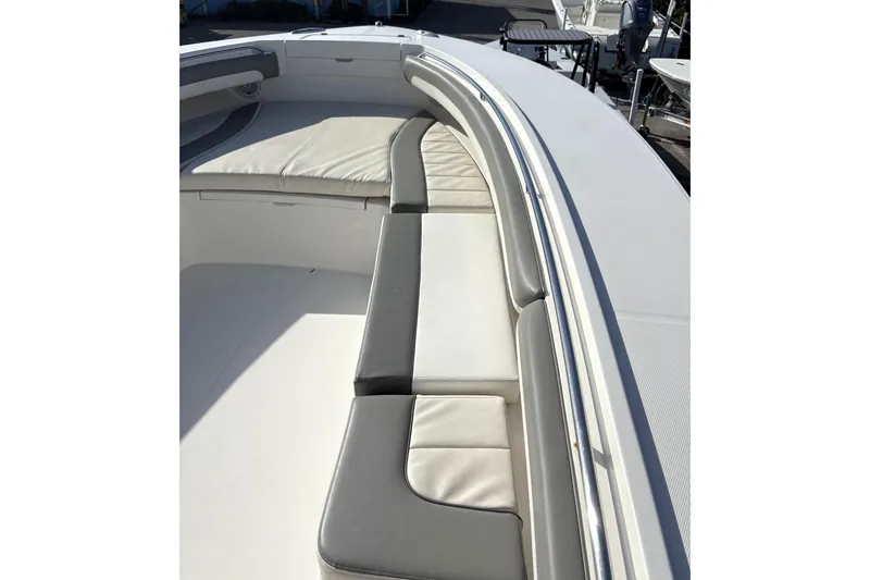 Slide: The Image of 2018 Regulator 34 Center Console boat with cushioned seating area. - 13
