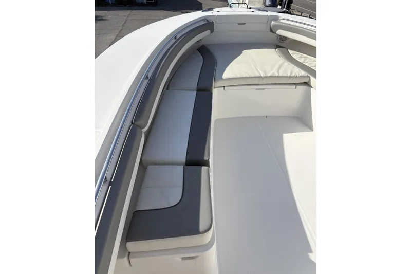 Slide: The Image of 2018 Regulator 34 Center Console boat interior with cushioned seating and sleek design. - 14