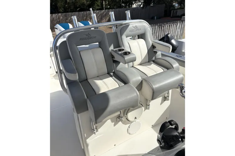 Slide: The Image of 2018 Regulator 34 Center Console boat seats with cup holders and armrests. - 21