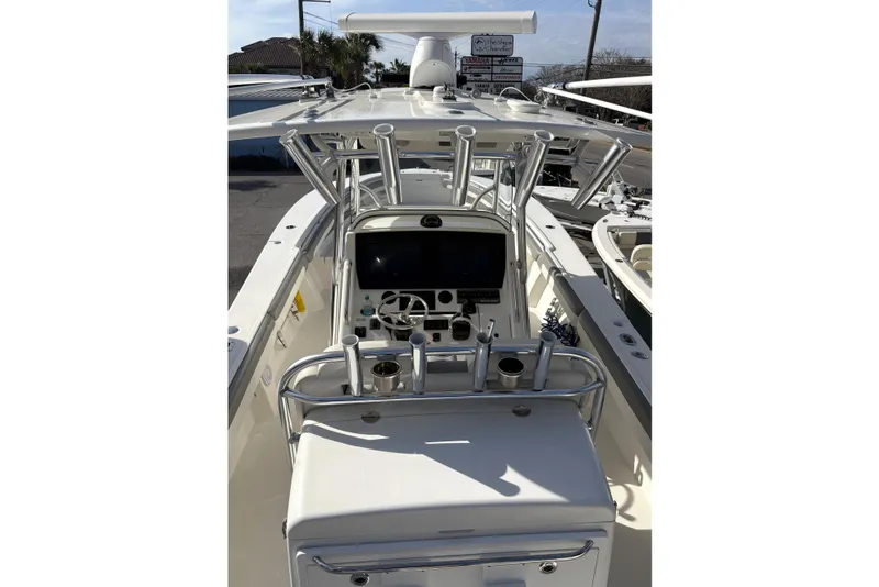 Slide: The Image of 2018 Regulator 34 Center Console boat interior with steering wheel and control panel. - 22