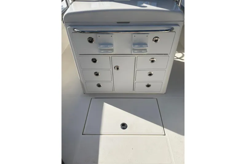 Slide: The Image of 2018 Regulator 34 Center Console storage compartments and deck view. - 23