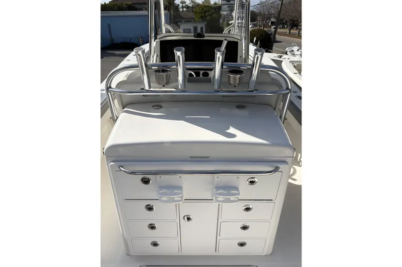 Slide: The Image of 2018 Regulator 34 Center Console boat with rod holders and storage compartments. - 25
