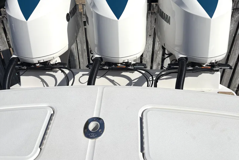 Slide: The Image of 2018 Regulator 34 Center Console with triple Yamaha outboard engines. - 27