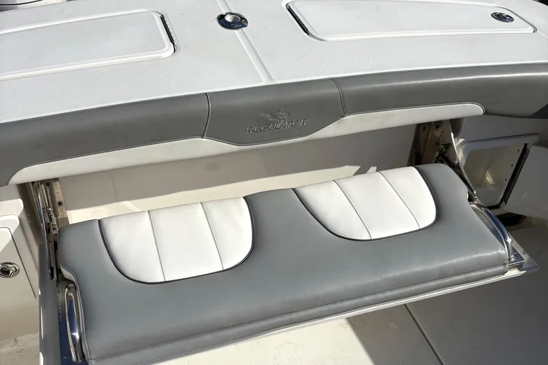 Slide: The Image of 2018 Regulator 34 Center Console boat with foldable seating and sleek design. - 29