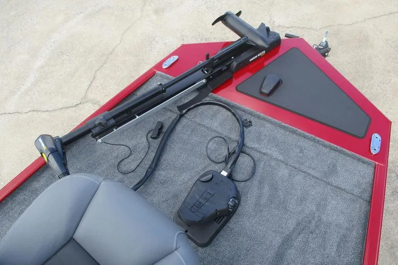 Slide: The Image of 2026 Tracker Bass Tracker Classic XL boat deck with trolling motor and control pedal. - 3