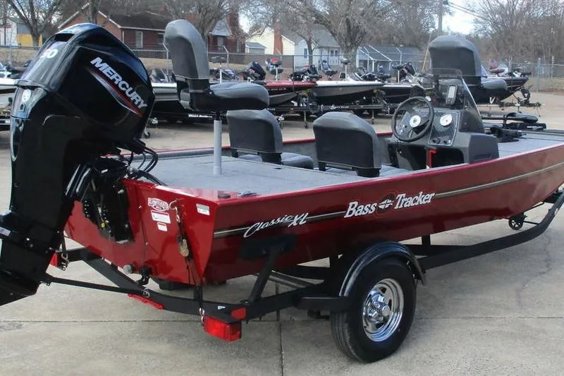 Slide: The Image of 2026 Tracker Bass Tracker Classic XL boat with Mercury engine on trailer. - 4