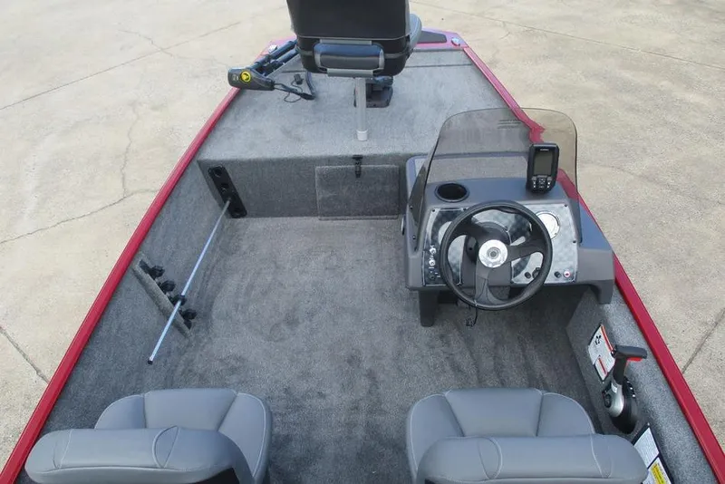 Slide: The Image of 2026 Tracker Bass Tracker Classic XL boat interior with steering console and seating. - 5