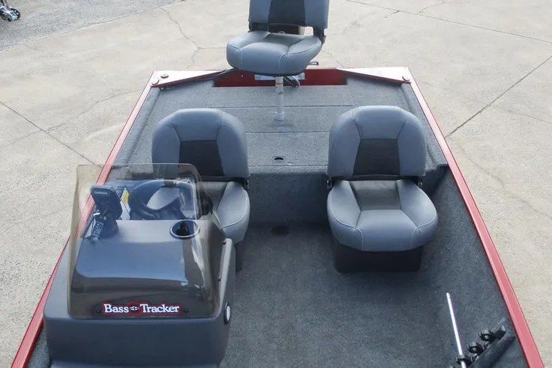 Slide: The Image of 2026 Tracker Bass Tracker Classic XL boat interior with three gray seats and console. - 9