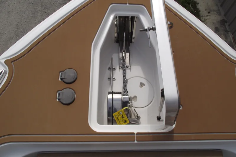 Slide: The Image of 2023 Sea Hunt Ultra 265 SE anchor locker with chain and winch system. - 10