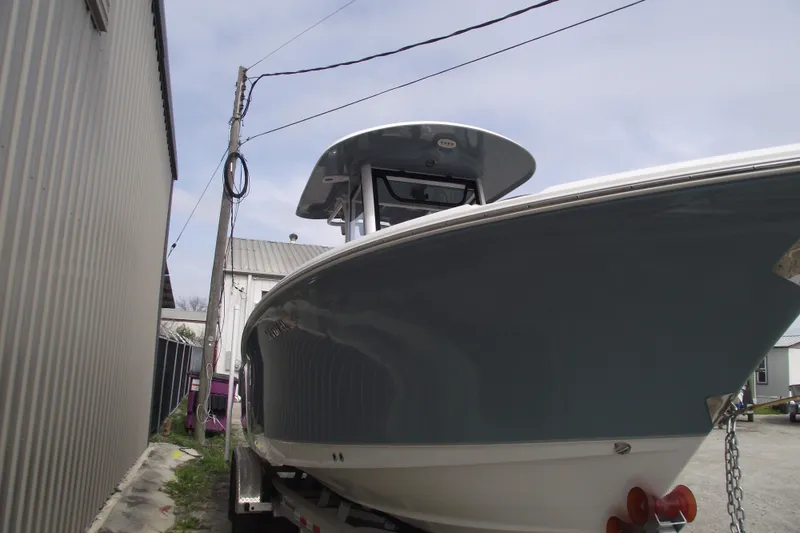 Slide: The Image of 2023 Sea Hunt Ultra 265 SE boat on trailer, side view. - 2