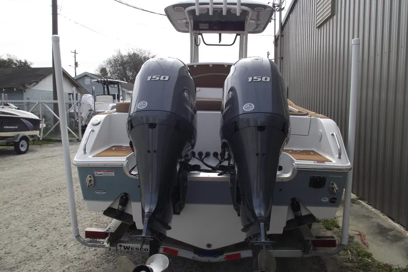 Slide: The Image of 2023 Sea Hunt Ultra 265 SE boat with dual 150 horsepower engines. - 3