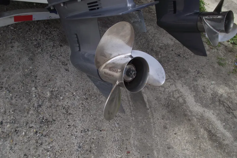 Slide: The Image of Propeller of 2023 Sea Hunt Ultra 265 SE boat on sandy ground. - 4