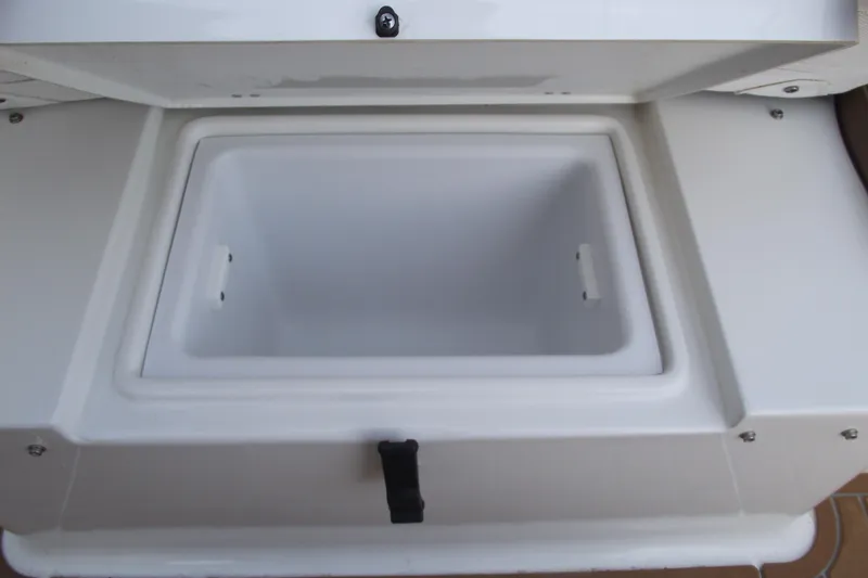 Slide: The Image of 2023 Sea Hunt Ultra 265 SE boat storage compartment, open and empty. - 7