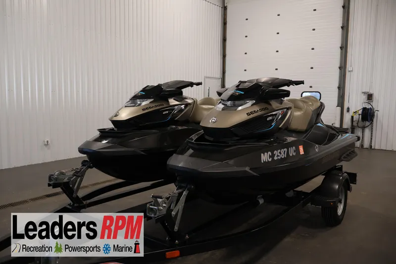 The Image of 2017 Sea-Doo GTX Limited S 260 jet skis on trailer in indoor showroom. - 1