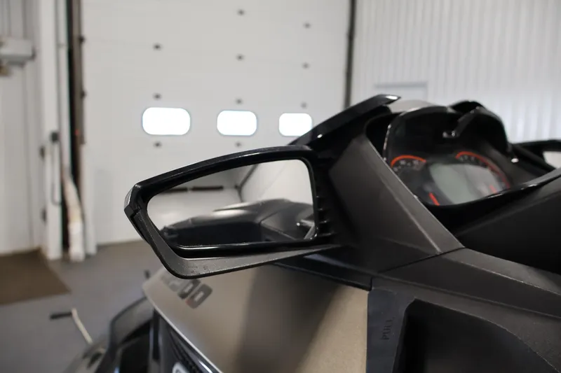Slide: The Image of 2017 Sea-Doo GTX Limited S 260 rearview mirror and dashboard in a garage setting. - 11