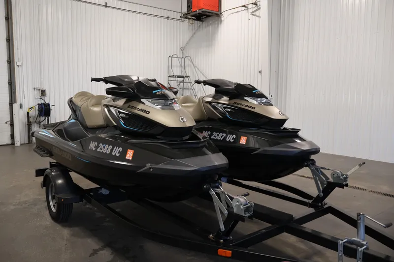 Slide: The Image of 2017 Sea-Doo GTX Limited S 260 jet skis on trailer in garage. - 3
