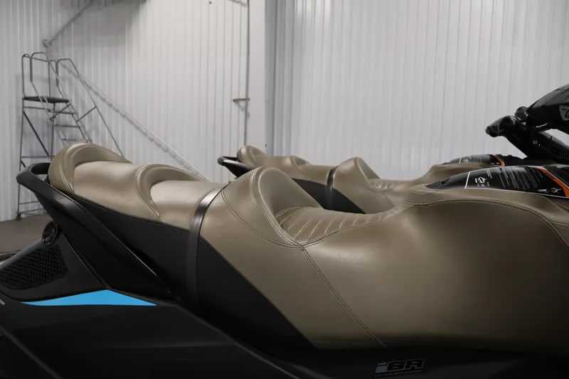Slide: The Image of 2017 Sea-Doo GTX Limited S 260 jet ski with beige seats in a storage facility. - 31