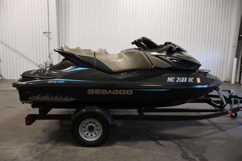 Slide: The Image of 2017 Sea-Doo GTX Limited S 260 jet ski on trailer in indoor setting. - 4