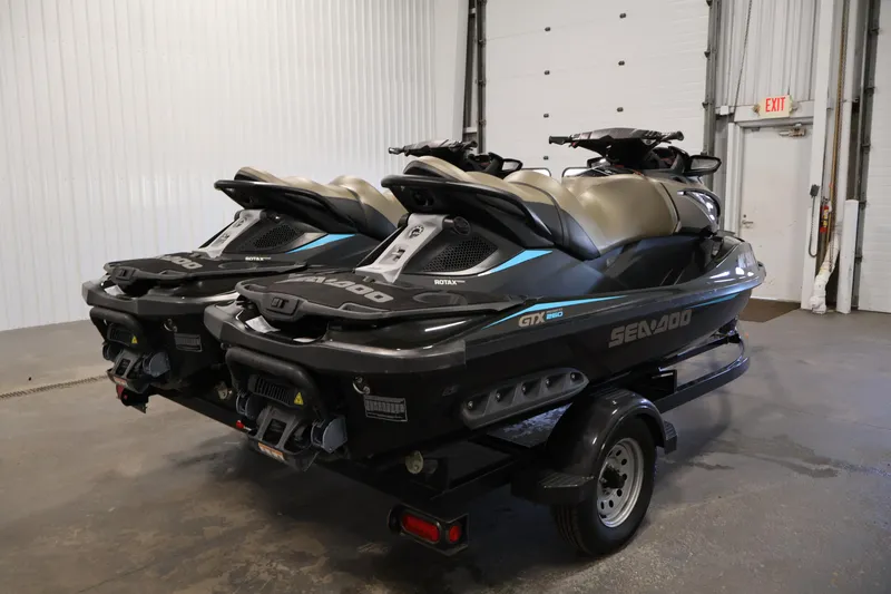 Slide: The Image of 2017 Sea-Doo GTX Limited S 260 jet skis on trailer in garage. - 5