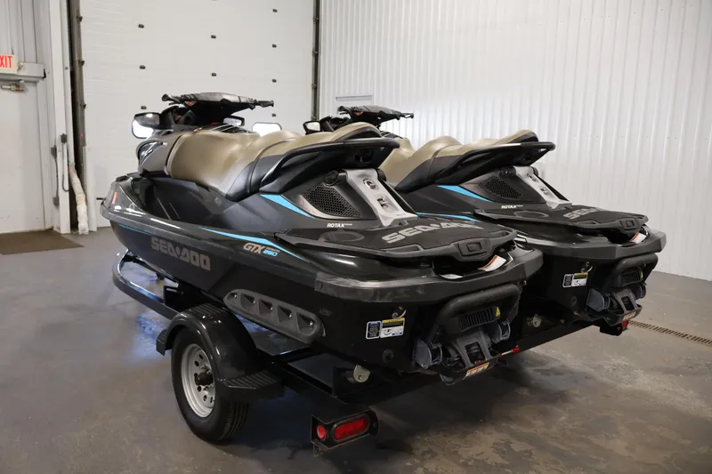 Slide: The Image of 2017 Sea-Doo GTX Limited S 260 jet skis on trailer in garage. - 7