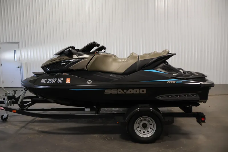 Slide: The Image of 2017 Sea-Doo GTX Limited S 260 jet ski on trailer in indoor setting. - 8
