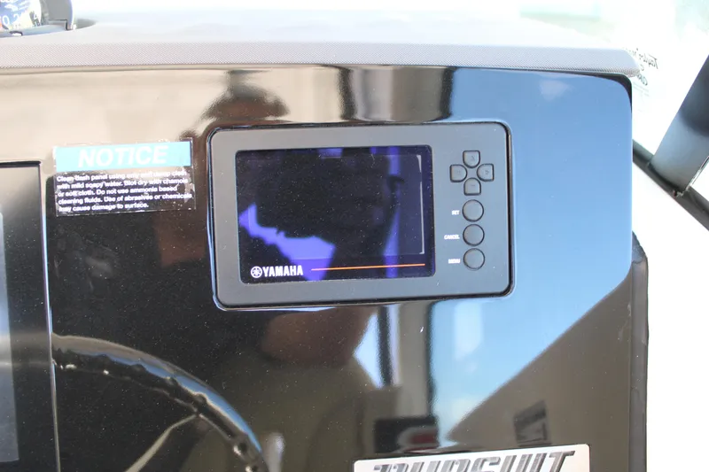 Slide: The Image of 2020 Pursuit DC 235 Dual Console dashboard with Garmin display and steering wheel. - 27