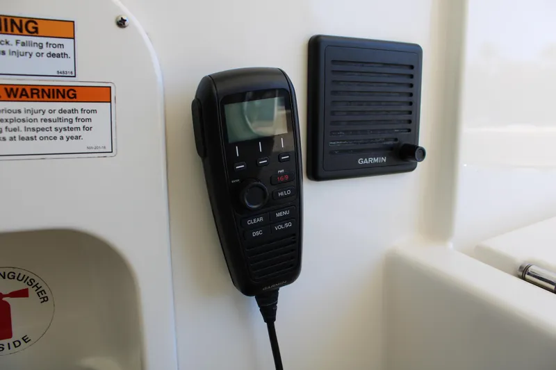 Slide: The Image of Control panel of a 2020 Pursuit DC 235 Dual Console boat with labeled switches. - 29