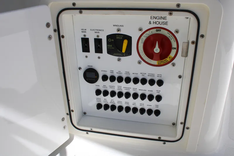 Slide: The Image of 2020 Pursuit DC 235 Dual Console boat interior with steering wheel and dashboard. - 31