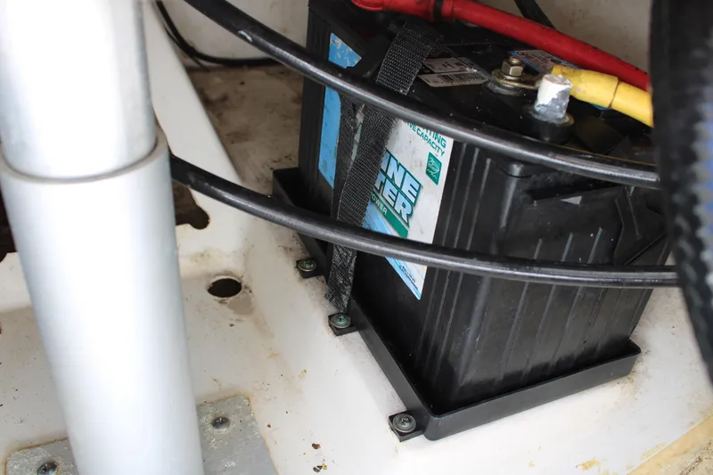 Slide: The Image of Control panel of 2020 Pursuit DC 235 Dual Console boat, featuring switches and battery controls. - 32