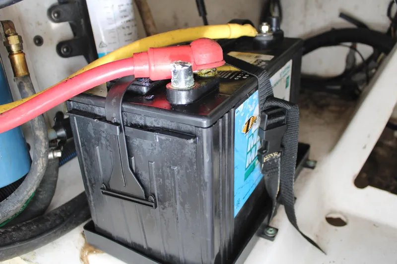 Slide: The Image of Battery compartment of 2020 Pursuit DC 235 Dual Console boat, featuring secure wiring connections. - 33