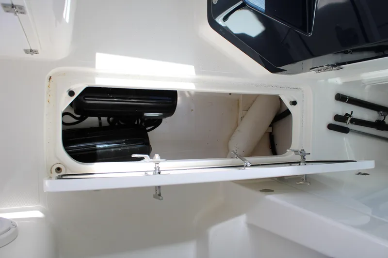 Slide: The Image of 2020 Pursuit DC 235 Dual Console boat with a protective cover. - 38