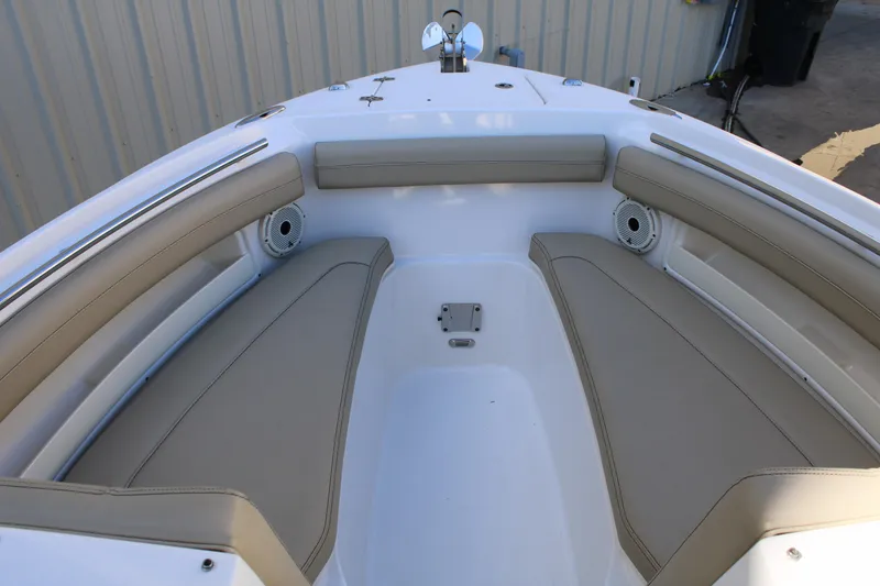 Slide: The Image of 2020 Pursuit DC 235 Dual Console at a scenic marina dock. - 42