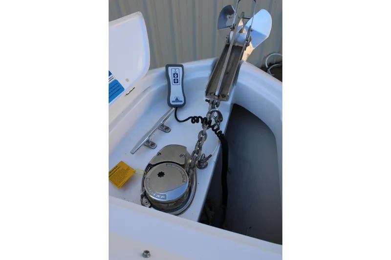 Slide: The Image of 2020 Pursuit DC 235 Dual Console anchor locker with chain and cleat. - 44