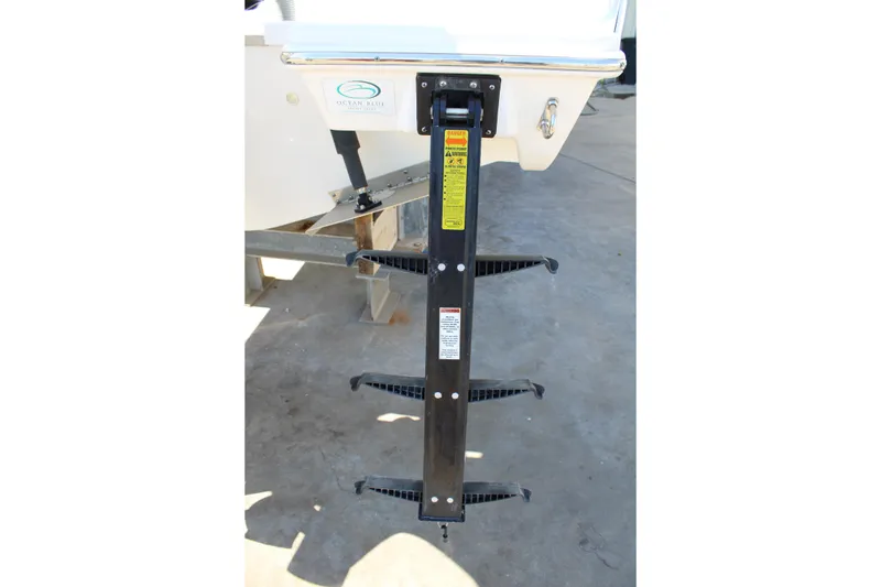 Slide: The Image of 2020 Pursuit DC 235 Dual Console boat storage compartment with safety gear and accessories. - 51