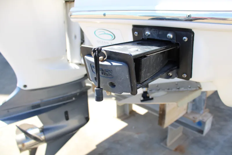 Slide: The Image of 2020 Pursuit DC 235 Dual Console boat ladder on concrete surface. - 52