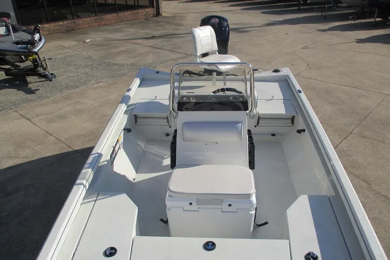 Slide: The Image of 2026 Ranger RB200 boat interior with seating and steering console, displayed outdoors. - 10
