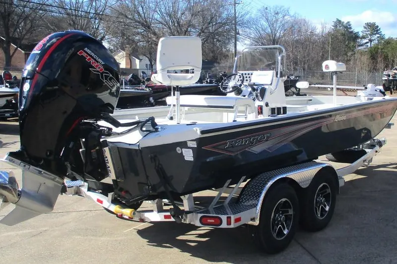 Slide: The Image of 2026 Ranger RB200 boat with Mercury engine on a trailer, parked outdoors. - 3