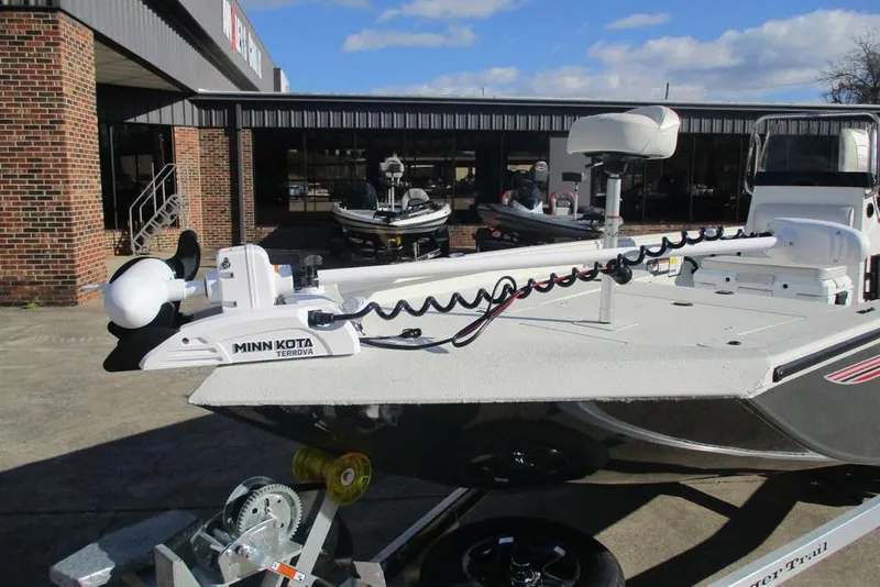 Slide: The Image of 2026 Ranger RB200 boat with Minn Kota Terrova motor displayed outside a dealership. - 5