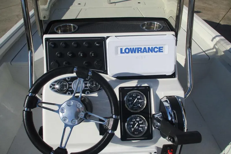 Slide: The Image of 2026 Ranger RB200 boat console with steering wheel, gauges, and Lowrance Elite display. - 9